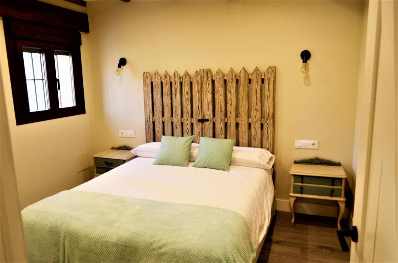 Apartamentos La Rosa Y El Pastor Guijo de Santa Bárbara Rum bild